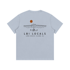 A light blue short-sleeve t-shirt shown from the back, featuring a black graphic of a bridge, boats, and a sun, with the text 'LBI LOCALS' and 'LONG BEACH ISLAND, NJ' printed below.