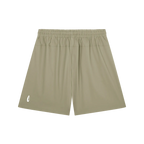 A pair of athletic shorts in a muted khaki or olive-tan color, featuring an elastic waistband and a small white logo on the lower left leg, displayed against a solid white background.