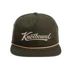 Front view of the Knotbound Surf Cap in moss, an unstructured low profile nylon cap.