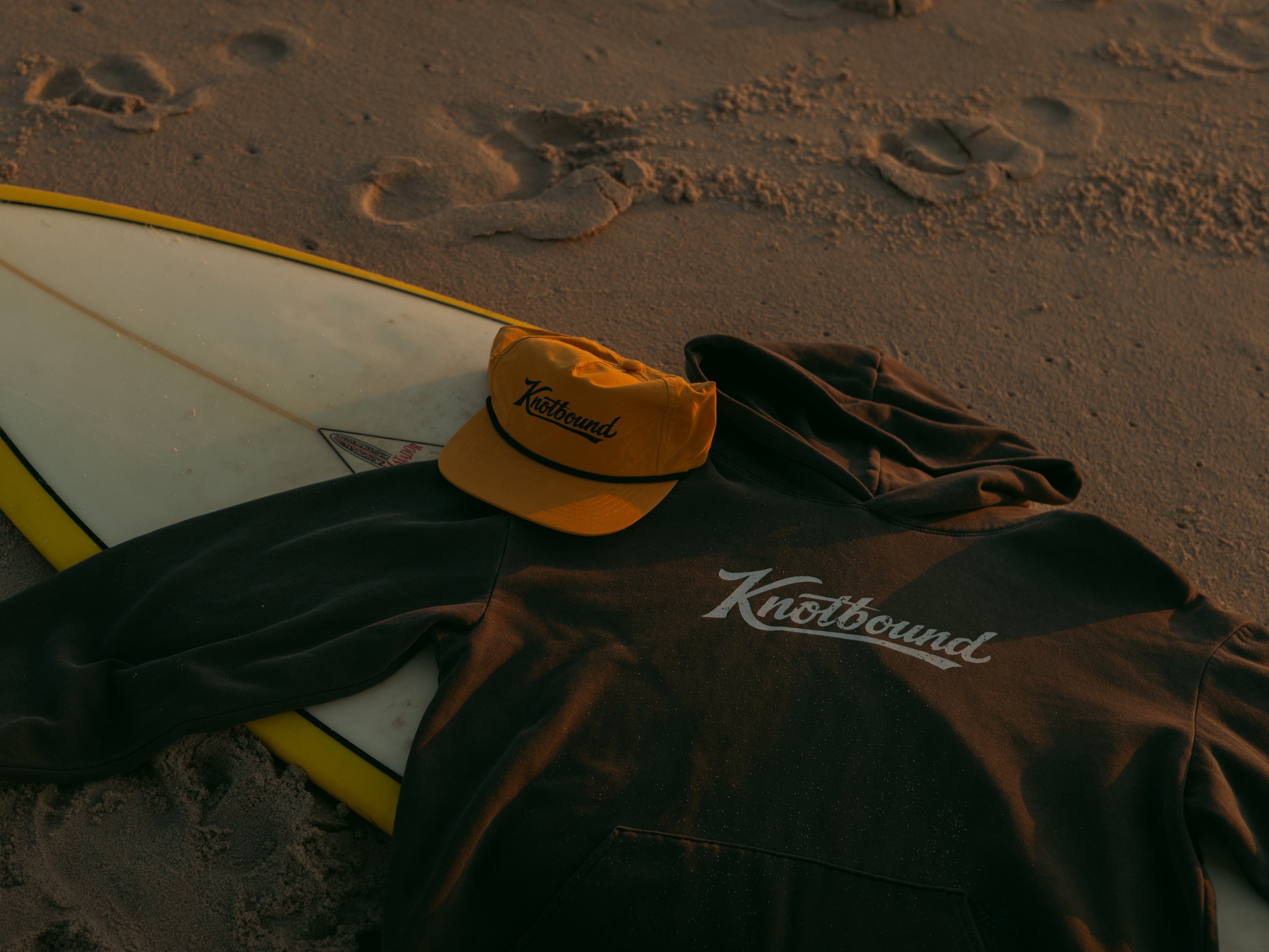 Lifestyle photo featuring the Knotbound Drifter Hoodie in pigment black.