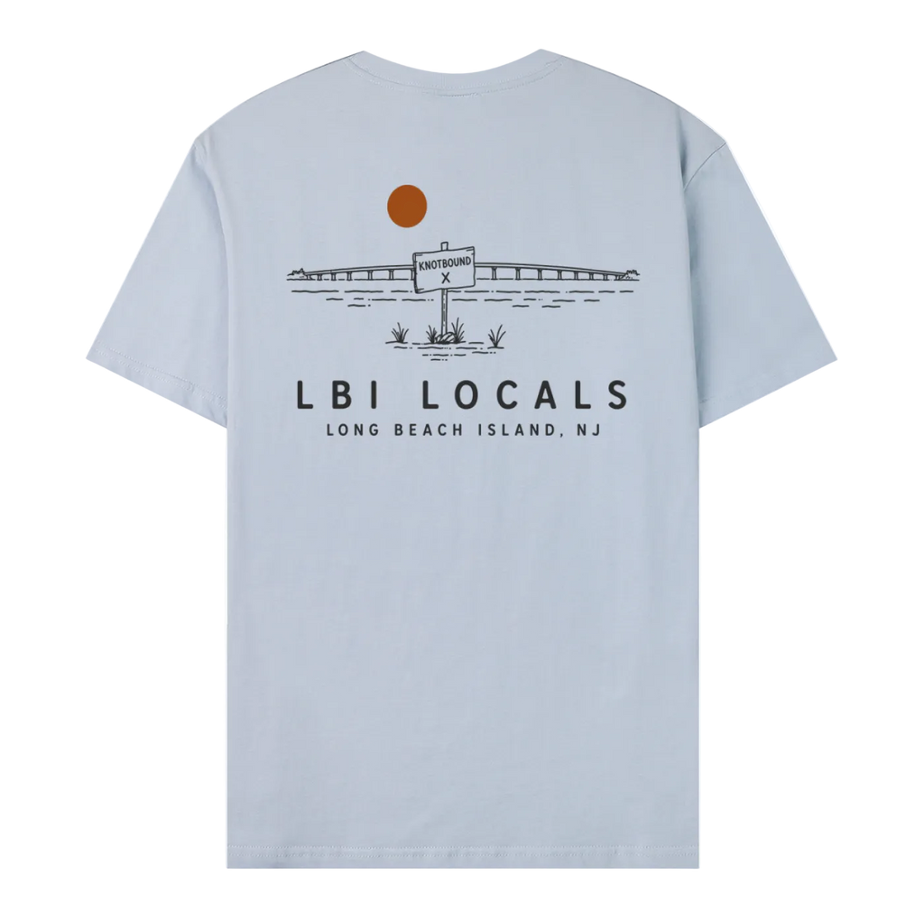 A light blue short-sleeve t-shirt shown from the back, featuring a black line art graphic of a bridge, a sign reading 'LONG BEACH ISLAND, NJ', and the text 'LBI LOCALS' with 'LONG BEACH ISLAND, NJ' underneath.
