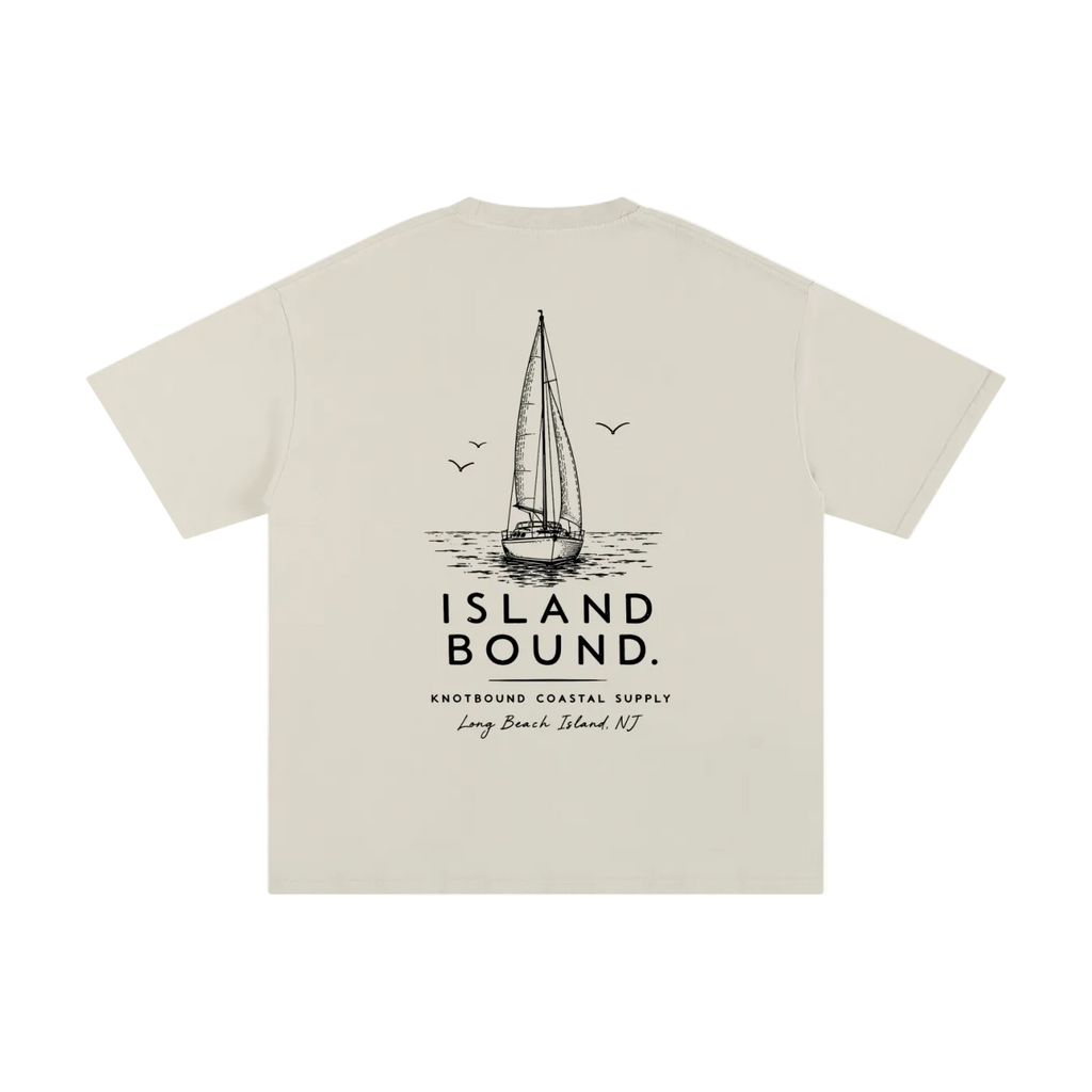 Beige t-shirt with sailboat graphic and 'Island Bound' text on a white background
