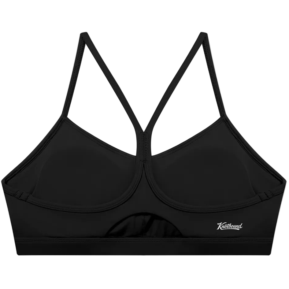 Black bikini top with thin straps on a white background