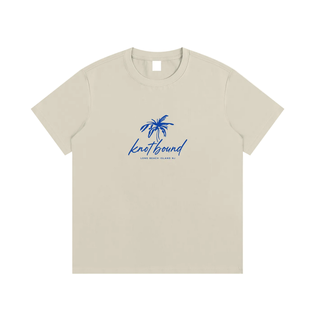 Beige t-shirt with blue palm tree design and text on a white background