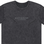 Close up of the Knotbound Island Bound Stonewash Tee, showing the Knotbound Live Untethered chest print.