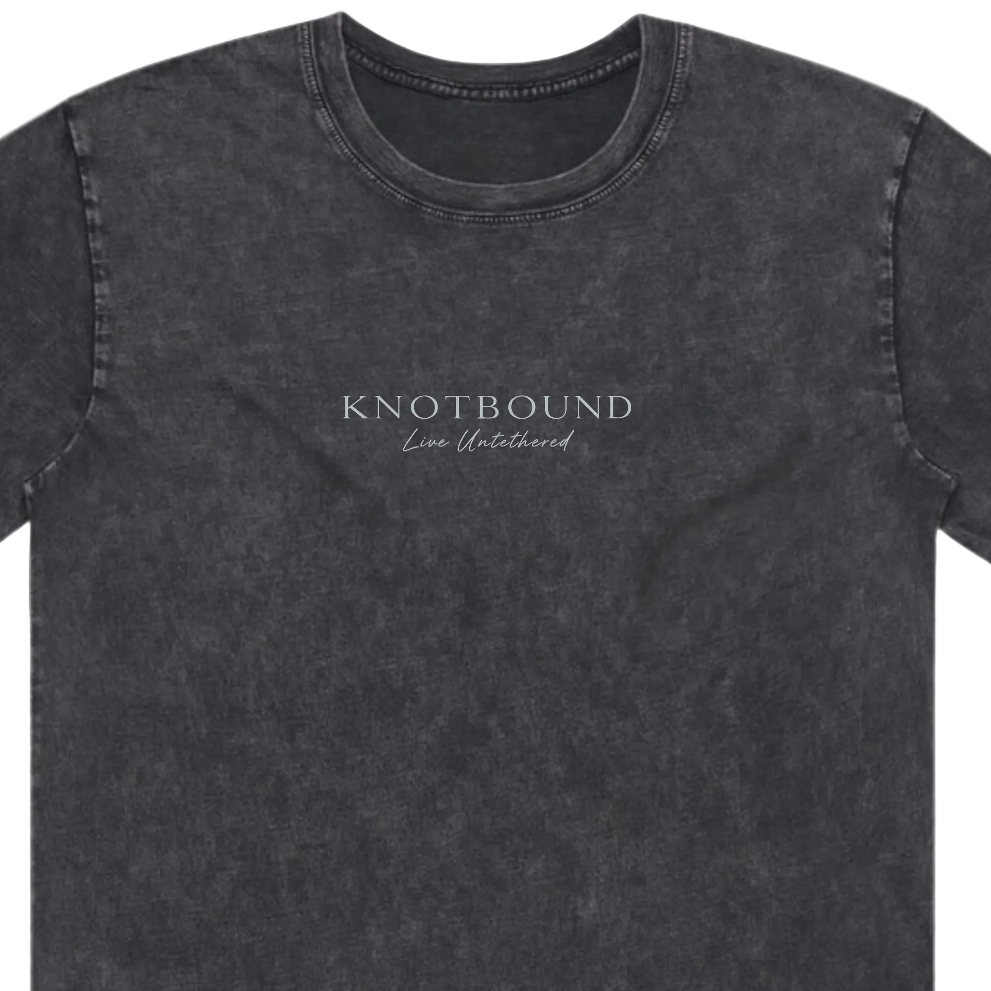 A dark gray mineral-wash crewneck t-shirt with 'KNOTBOUND' and 'Live Unleashed' printed in white on the chest, shown against a plain white background.